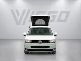Volkswagen T5 KWB (2015) met hefdak en spoiler — vooraanzicht