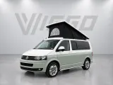 Volkswagen T5 KWB (2015) met hefdak en spoiler — schuin van voren